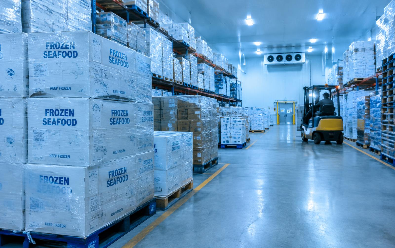 Cold storage warehouse with pallets of frozen food